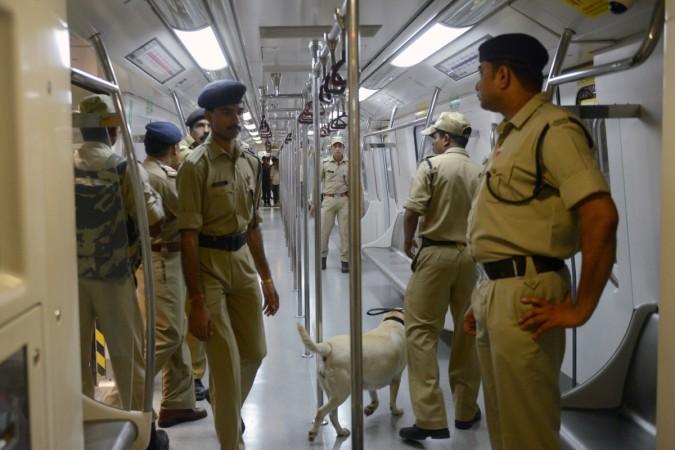 Indian security personnel are pictured in a Delhi Metro train at the newly-opened Mandi House station platform, which connects to Central Secretariat, during a flagging off ceremony in New Delhi on June 26, 2014. The Delhi Metro opened the Mandi House - Central Secretariat route to the public on June 26. Over two million commuters use the Delhi Metro in the Indian capital daily. Indian security personnel are pictured in a Delhi Metro train