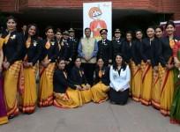 Chairman and Managing Director Air India, Ashwani Lohani (C) stands with the pilots and crew members of an all-women Air India