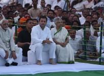 Indian Congress party president Rahul Gandhi (C), accompanied by former New Delhi chief minister Sheila Dikshit