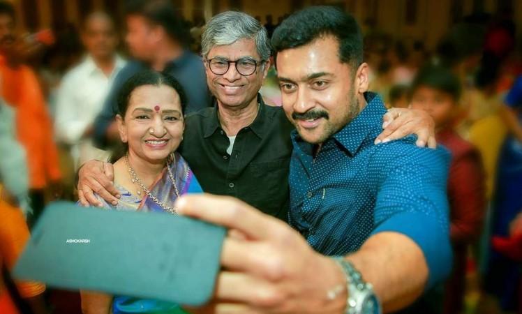 Shobha Chandrasekhar, SA Chandrasekar and Suriya. Suriya with Vijay's parents - SA Chandrasekar and Shobha