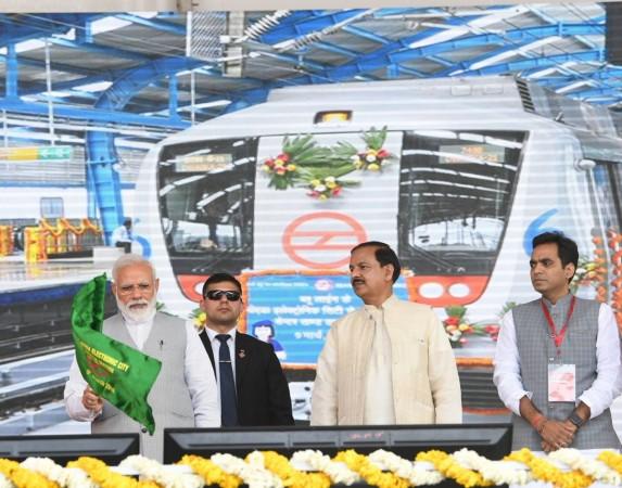 Greater Noida: Prime Minister Narendra Modi flags off Noida City Centre - Noida Electronic City Section of the Delhi Metro's blue line at Greater Noida, Uttar Pradesh on March 9, 2019. Also seen Union Minister of State for Culture Dr. Mahesh Sharma. Prime Minister Narendra Modi