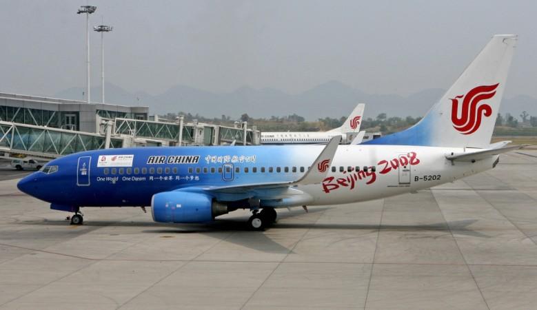 an Air China Boeing 737 jet painted to promote the Beijing 2008 Olympic Games, prepares to leave Chongqing airport