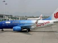an Air China Boeing 737 jet painted to promote the Beijing 2008 Olympic Games, prepares to leave Chongqing airport