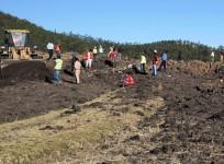 Rescue and recovery personnel use an earth mover to recover debris from the area where Ethiopian Airlines Flight 302 crashed in a wheat field just outside the town of Bishoftu, 62 kilometers southeast of Addis Ababa on March 10, 2019 in Addis Ababa, Ethio