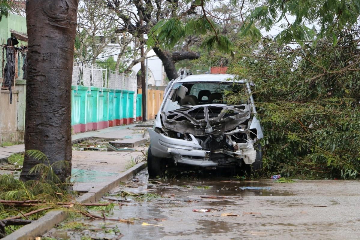 A destroyed car is seen amid the destruction provoked by the passage of the cyclone Idai in Beira, Mozambique, on March 17, 2019 Mozambique