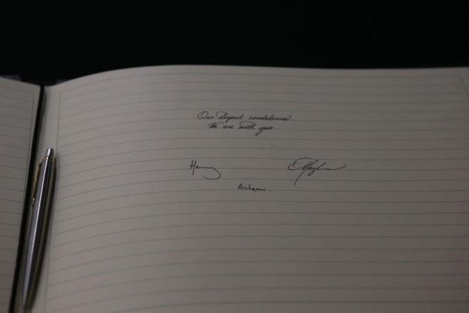 Meghan, Duchess of Sussex and Prince Harry, Duke of Sussex sign a book of condolence on behalf of The Royal Family at New Zealand House. Meghan Markle's letter