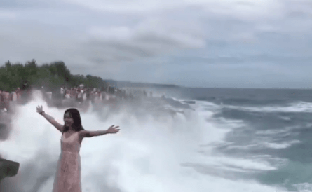 The woman was posing for a photo on an island off Bali. Bali tourist