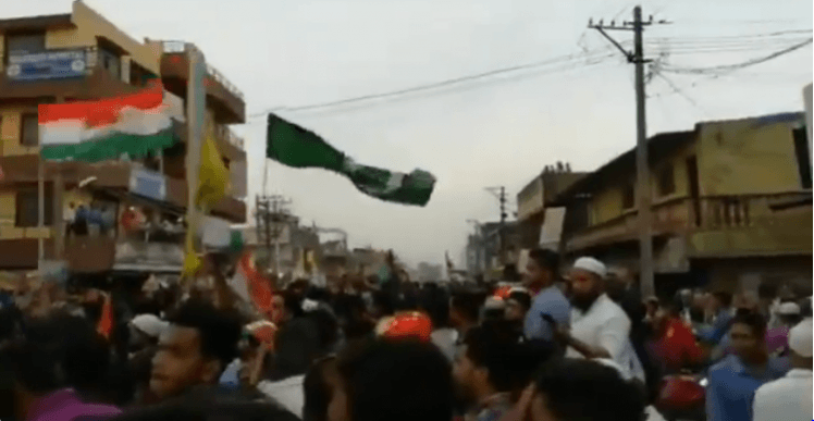 A green-coloured flag with a crescent and star flew high at a rally. Congress rally karnataka