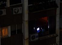 A man uses a laptop during a power outage in Caracas, Venezuela, on March 26, 2019
