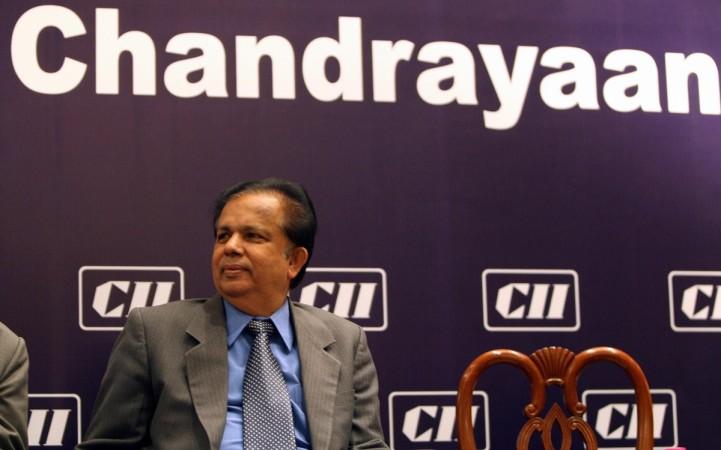 Indian Space Research Organisation (ISRO) Chairman G. Madhavan Nair listens to Indian Minister of Overseas Affairs Vayalar Ravi prior to a felicitation ceremony in New Delhi on December 24, 2008. Confederation of Indian Industry (CII) felicitated officials of Chandrayan-1 team. Indian Space Research Organisation (ISRO) Chairman G Madhavan Nair