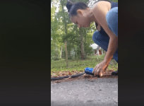 woman rescue's snake