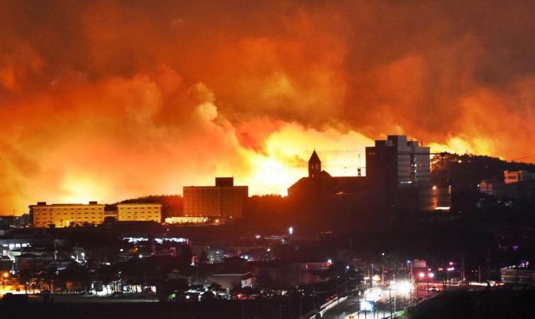 A forest fire raging near a town on April 5, 2019 in Sokcho, South Korea. South Korea grappled with the massive blaze that roared through forests and cities along the eastern coast, declaring a national emergency and mobilizing all available resources to bring the inferno under control. South Korean forest fire