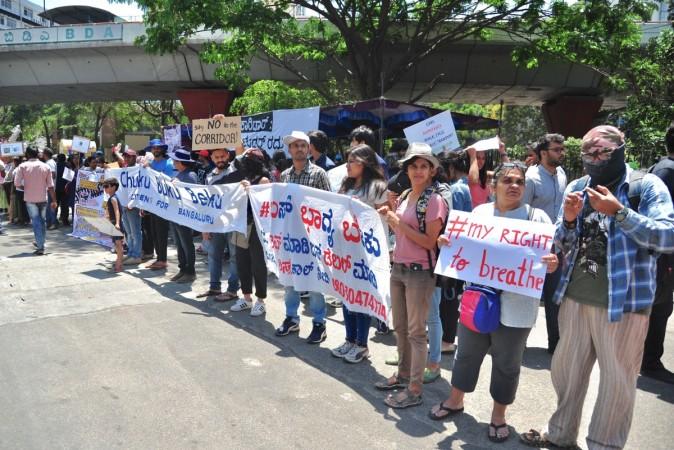 Environmentally conscious citizens of Bangalore along with activists stage a protest against the proposed steel bridge flyover by the Karnataka government to decongest the city traffic, in Bangalore on March 16, 2019. Environmentally conscious citizens of Bangalore along with activists stage a protest against the proposed steel bridge flyover by the Karnataka government to decongest the city traffic