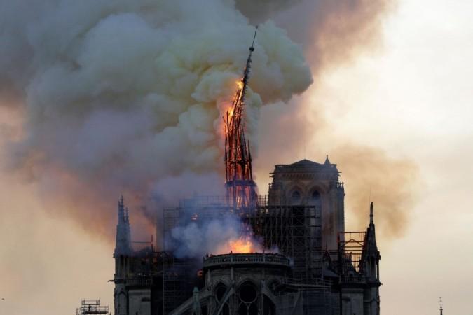 The spire of the landmark Notre Dame cathedral collapses. Notre Dame cathedral spire