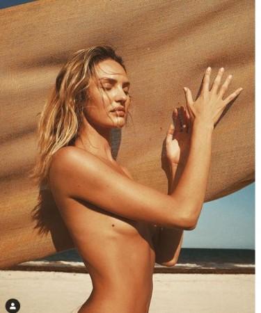 Victoria's Secret Angel Candice Swanepoel poses toples and flaunts