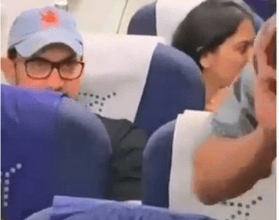 Aamir Khan travelling in economy class in Indigo Airlines. Aamir Khan travelling in economy class in Indigo Airlines