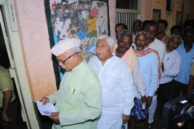 Gadag: Congress leader H. K. Patil waits for his turn to cast his vote for the third phase of 2019 Lok Sabha elections, at a polling station in Karnataka's Gadag, on April 23, 2019 Congress leader H. K. Patil waits for his turn to cast his vote for the third phase of 2019 Lok Sabha elections, at a polling station in Karnataka's Gadag, on April 23, 2019