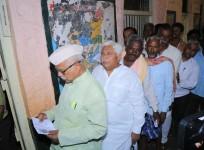 Congress leader H. K. Patil waits for his turn to cast his vote for the third phase of 2019 Lok Sabha elections, at a polling station in Karnataka's Gadag, on April 23, 2019