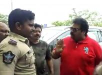 Ram Gopal Varma and producer Rakesh Reddy arguing with Vijayawada police