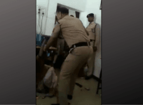 policeman beating woman