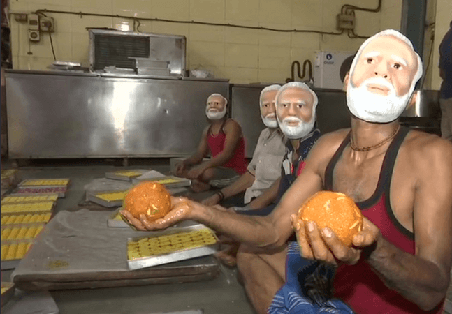 The shop owner said that the workers were excited to wear PM Modi's masks. mumbai modi