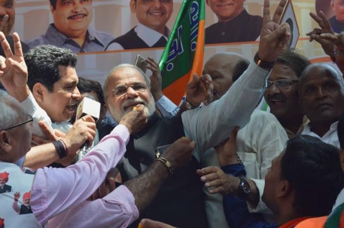 Mumbai: A look alike of Prime Minister Narendra Modi celebrates BJP's performance in the recently concluded 2019 Lok Sabha polls in Mumbai on May 23, 2019. Narendra Modi