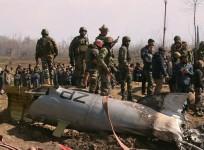 Indian soldiers stand next to the wreckage of an Indian Air Force helicopter after it crashed in Budgam district in Kashmir, February 27. REUTERS/Danish Ismail