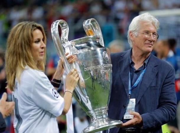 Gere with the Champions League trophy that Real Madrid won Richard Gere