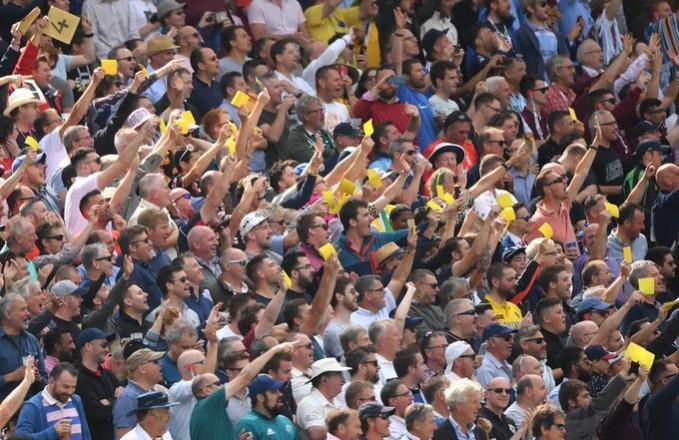 English fans wave sandpaper at Australian cricketers English fans