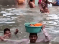 man rescues baby from neck-deep waters in Vadodara
