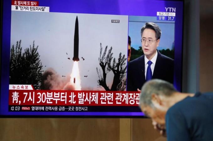 A man watches a TV showing a file picture for a news report on North Korea firing two unidentified projectiles in Seoul, South Korea, August 6, 2019. north korea missile launch