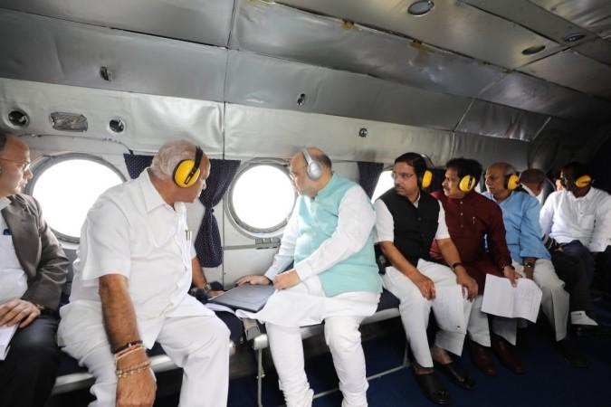 Home Minister Amit Shah and Karnataka CM BS Yediyurappa doing an aerial survey of the flood-affected areas of Belagavi district HM Amit Shah and Karnataka CM BS Yediyurappa doing an aerial survey of the flood affected areas of Belagavi district