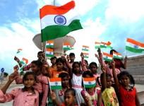 Lucknow: Children holding National Flags celebrate Independence Day, in Lucknow on Aug 14, 2019.