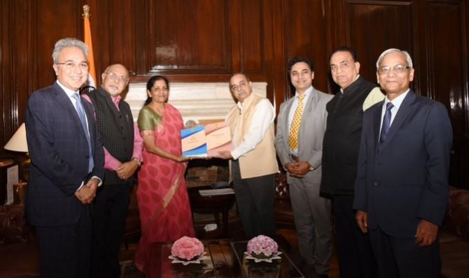 Union Minister of Finance and Corporate Affairs Smt. Nirmala Sitharaman received the report submitted by Shri Akhilesh Ranjan, Convenor of the Task force constituted by the Government to draft New Direct Tax Law, in New Delhi on Monday Direct tax Code
