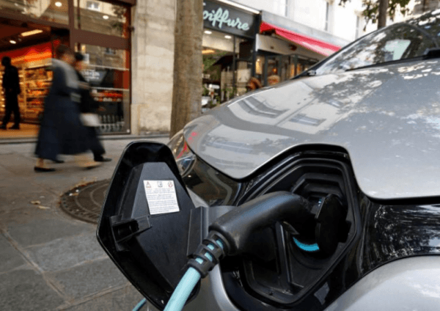 An electric car is being charged in a Paris street, France, September 12, 2017. REUTERS/Philippe Wojazer Electric Car