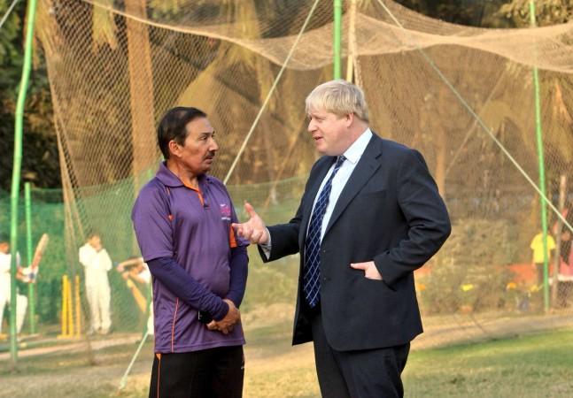 Boris Johnson with former India cricketer Arun Lal during a visit to India Boris Johnson