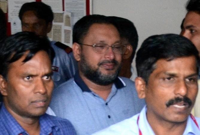 IMA Jewellers' founder and prime accused in the multi-crore Ponzi scam Mansoor Khan being taken to be produced before a Prevention of Money Laundering Act (PMLA) court in Bengaluru on July 20, 2019. Mansoor Khan