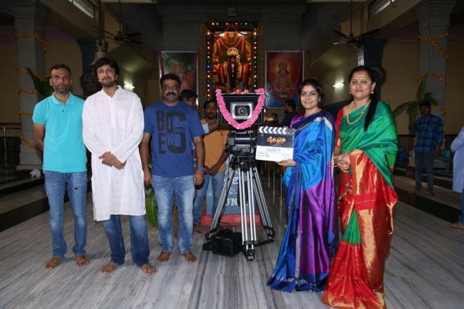 Sudeep with director S Krishna and producer Swapna Krishna, while Kiccha's wife gets ready to tap the clap for the first scene. Pailwaan Muhurat