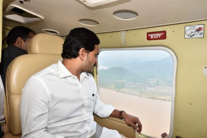 The CM flew in a helicopter over Kuchuluru, where the boat with over 60 tourists capsized. Godavari boat accident