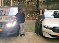 Puri Jagannadh and Charmy Kaur pose with their Range Rover Vogue and BMW 7 Series cars