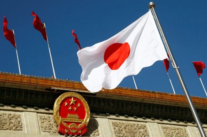 Japan's flag flutters outside the Great Hall of the People before a welcome ceremony for Japanese Prime Minister Shinzo Abe in Beijing, China, October 26, 2018. Japan China