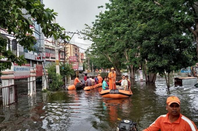 Rescue members evacuate people from a flood-affected neighbourhood in Patna, in the eastern state of Bihar, India, October 1, 2019. Monsoon rains