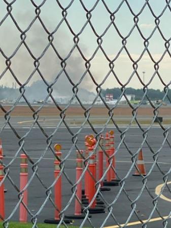 Smoke is seen from Windsor Locks at the site of an aeroplane crash in Bradley International Airport, Connecticut, United States October 2, 2019. Planecrash in Connecticut