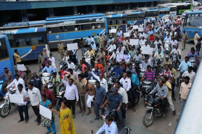 On 15th day of the transport strike, employees along with leaders and activists of opposition parties, trade unions, teachers and workers took to streets to protest what they call 'dictatorial' attitude of CM K Chandrashekhar Rao. Telangana transport strike