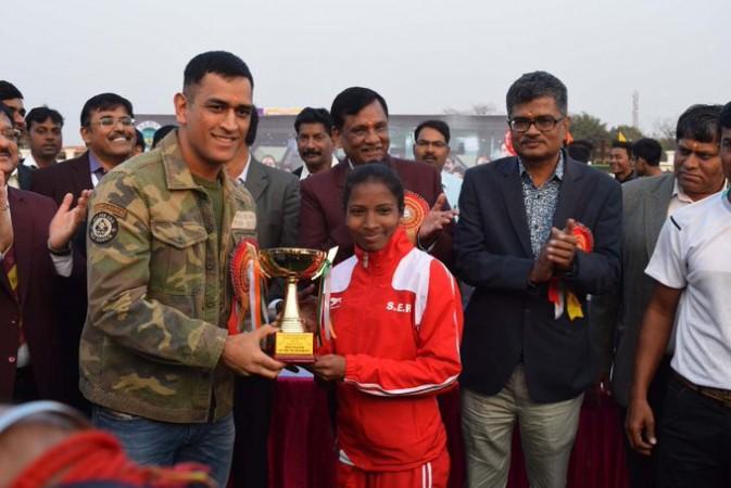 MS Dhoni presenting Nikki Pradhan an award after a hockey tournament in Ranchi Nikki Pradhan MS Dhoni