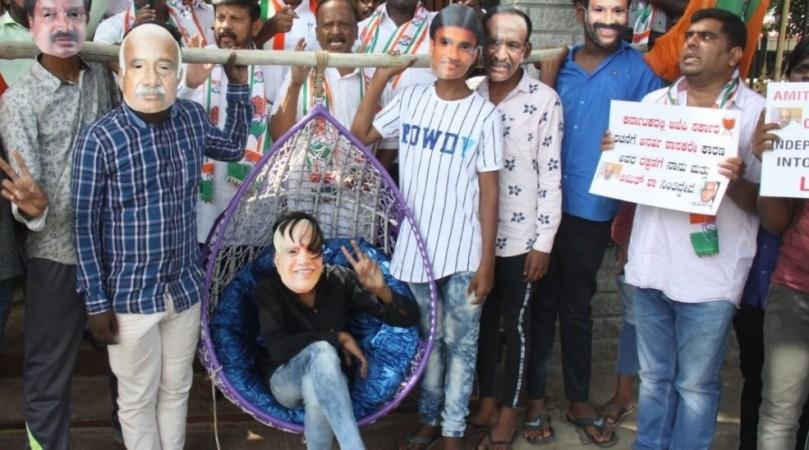 Congress workers staged a protest in Bengaluru over the purported video of Yediyurappa pertaining to resignations of MLAs and fall of the coalition government. Congress