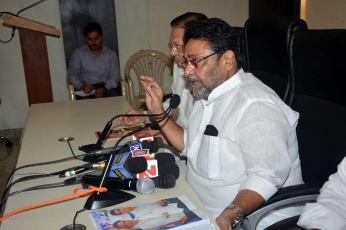 NCP spokesperson Nawab Malik addresses a press conference in Mumbai. NCP