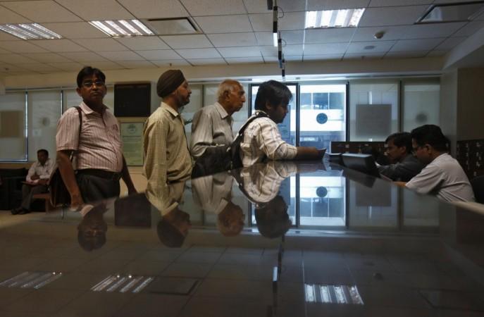 People line to submit their papers inside the Income Tax office in New Delhi. Tax