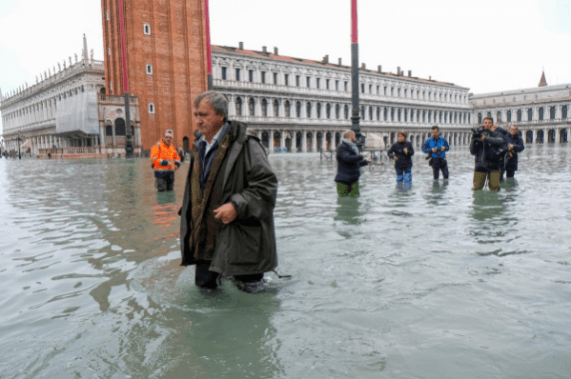 The Mayor of Venice Luigi Brugnaro walks on St Mark's Square during an exceptionally high water levels in Venice, Italy November 13, 2019. Reuters Venice Floods