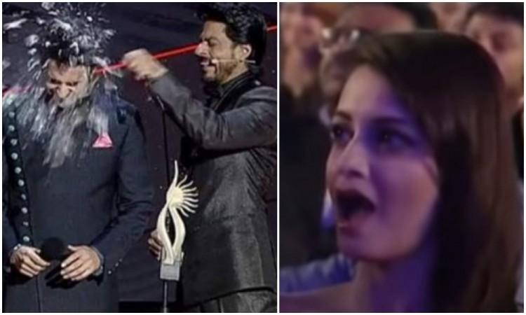 Shah Rukh Khan breaks glass bottle on Ayushmann Khurrana's head during IIFA 2012. Shah Rukh Khan breaks glass bottle on Ayushmann Khurrana's head during IIFA 2012